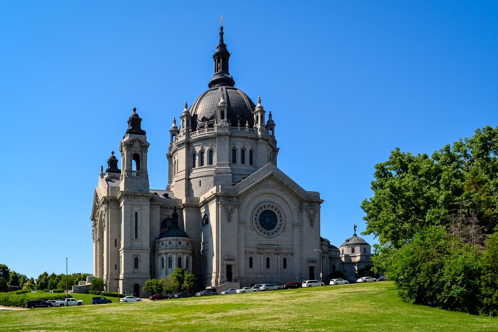 The domed Cathedral of Saint Paul on its hilltop lawn in Saint Paul under a clear blue sky